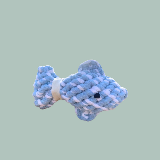 Blue and white rope dog toy shaped like a fish on a light green background