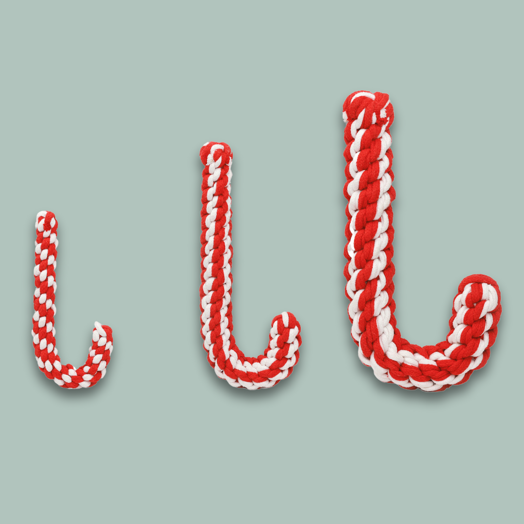 Front view of Christmas candy cane pet toy made of woven cotton rope, perfect for pets to chew and play during the holiday season