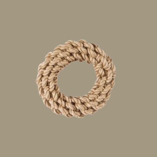 Beige woven ring on a beige background