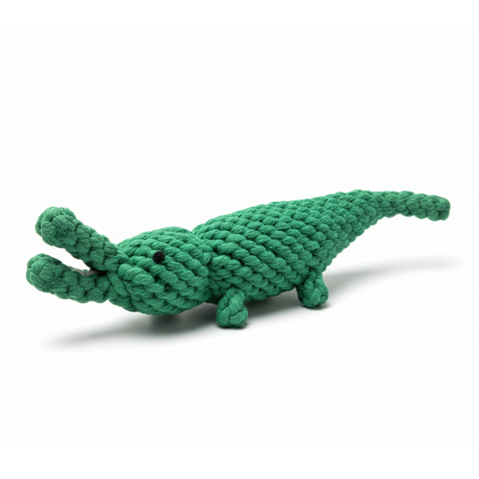 Green crocodile-shaped rope toy on a white background