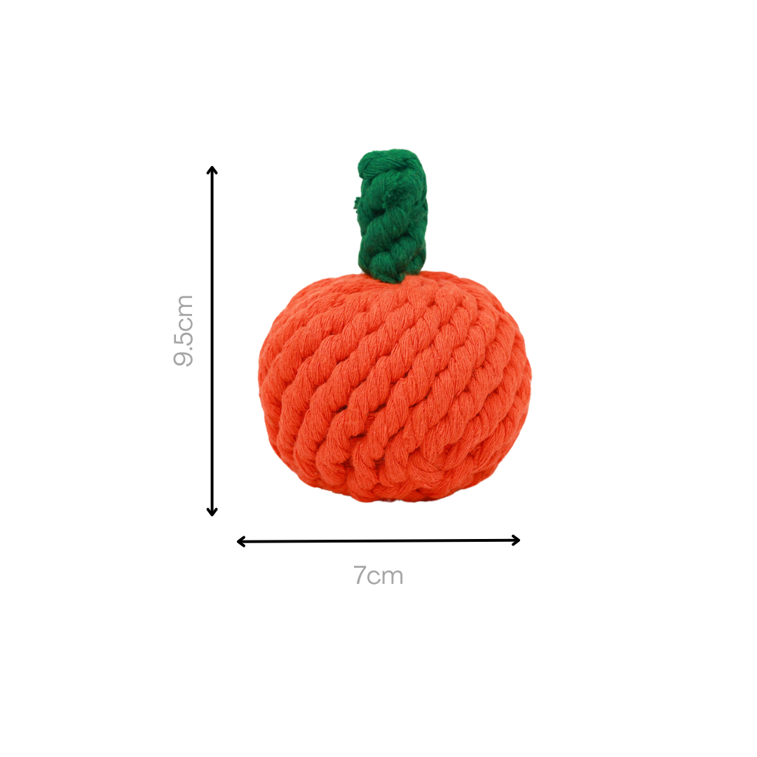 Handmade orange rope dog toy with a green handle.