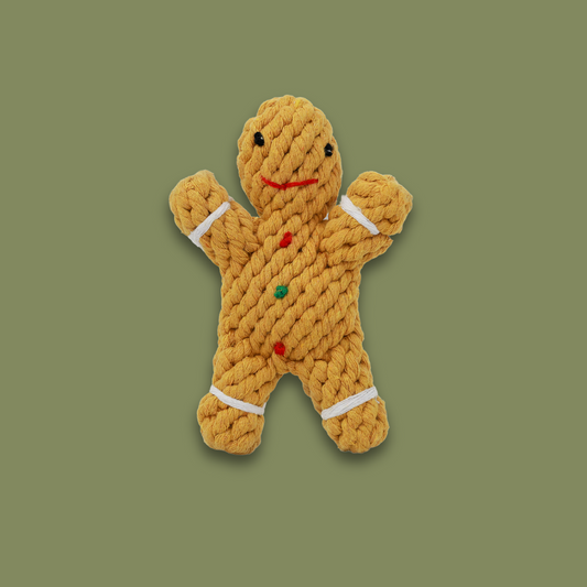 Handwoven gingerbread man pet toy made from durable cotton rope. Ideal for dogs and cats to chew, play, and enjoy. A festive and sturdy addition to your pet's toy collection.