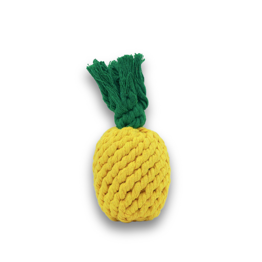 A handmade small pineapple-shaped rope toy in yellow and green colors.