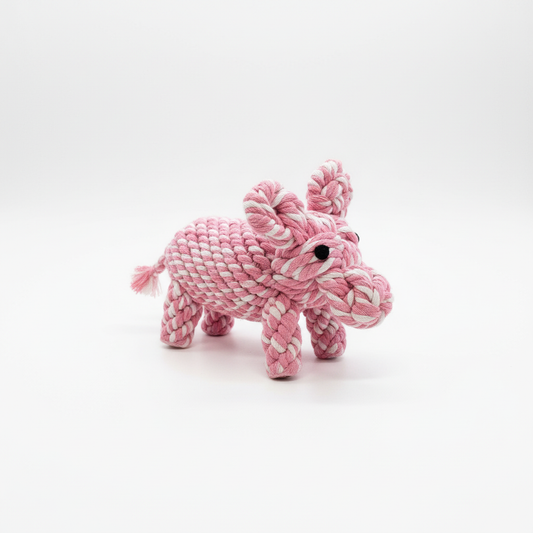 Pink and white rope pig toy on a white background