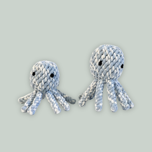 Two knitted octopus toys on a light gray background