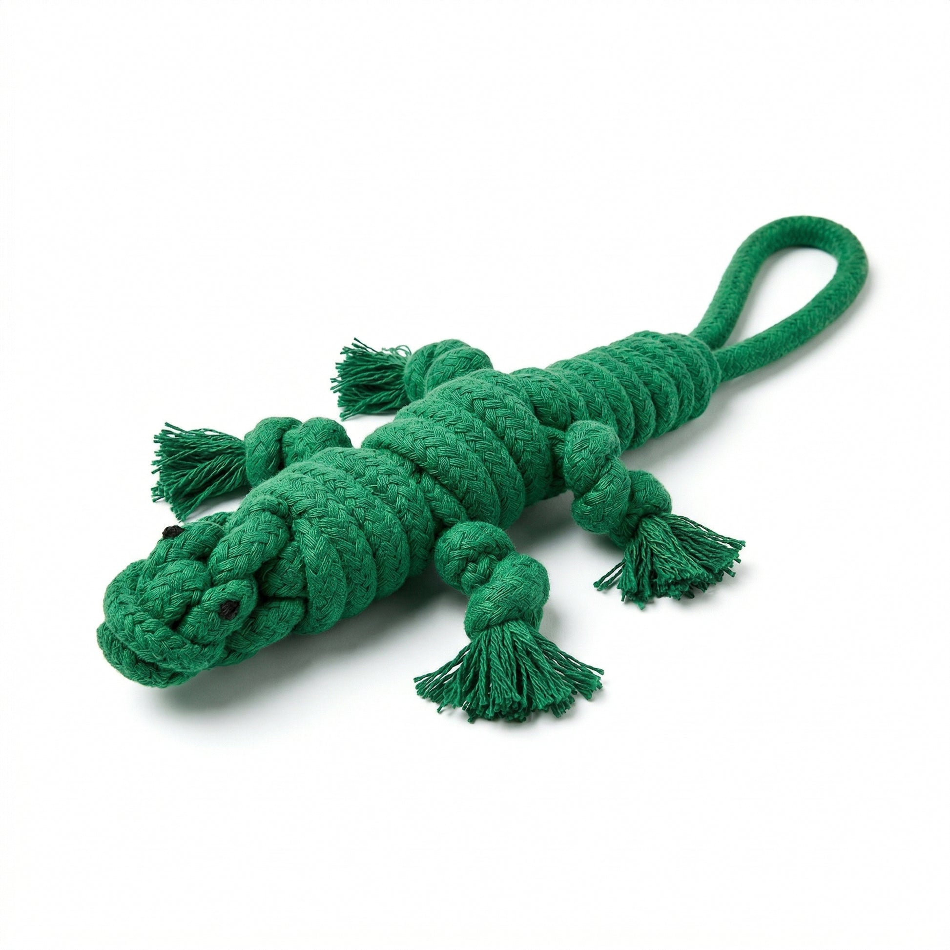 Green crocodile-shaped rope toy on a white background