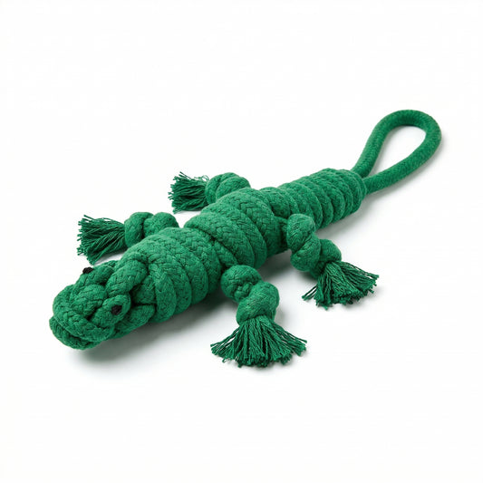 Green crocodile-shaped rope toy on a white background
