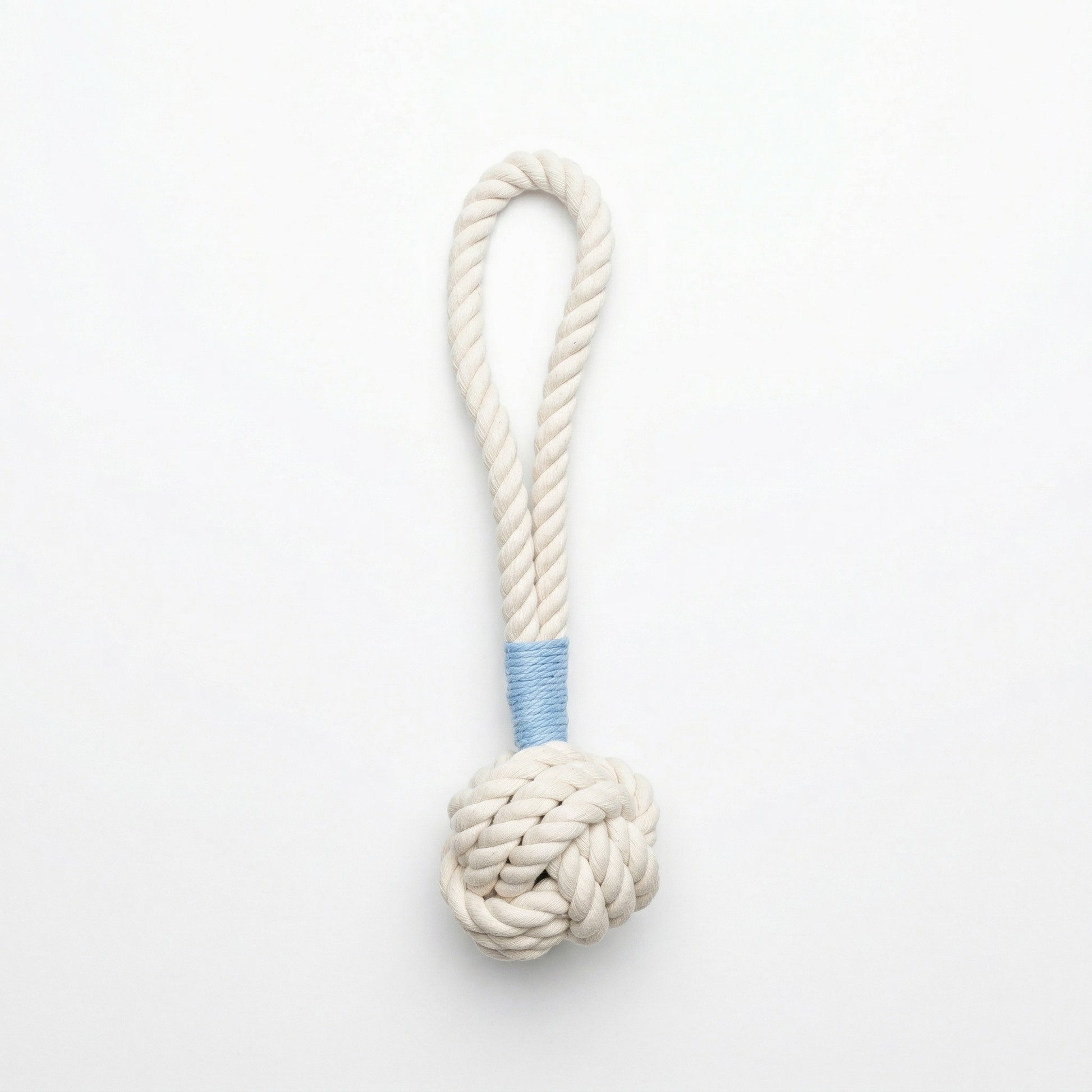 White rope toy with a blue  wrap on a white background