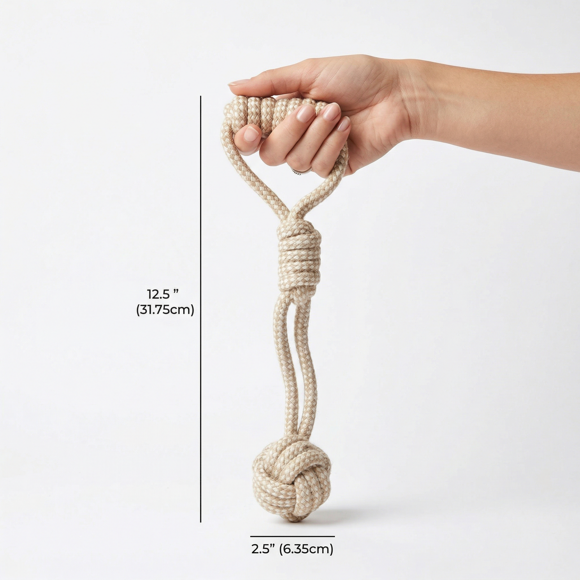 Hand holding a knotted rope with measurements on a white background