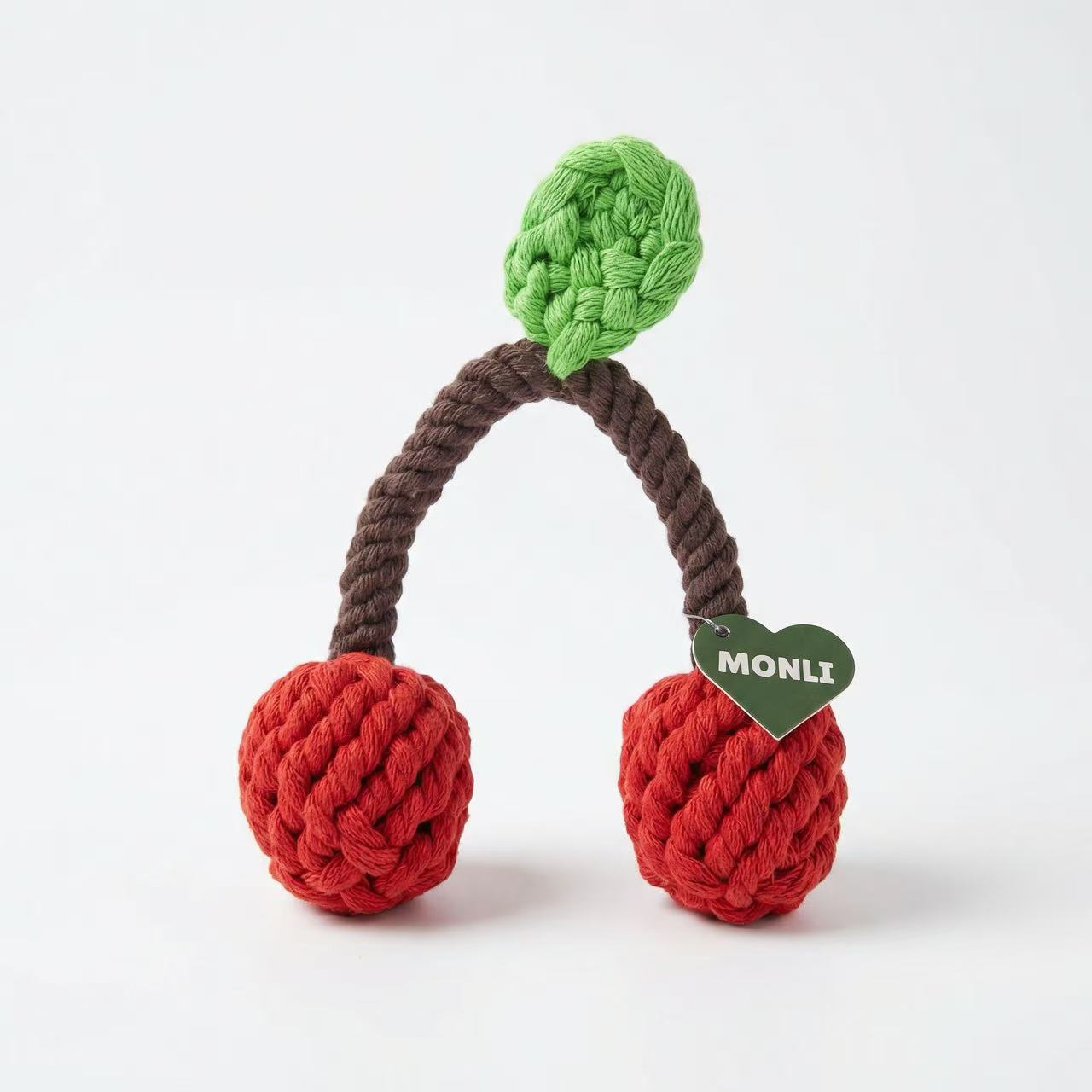 Dog toy shaped like cherries with a green top on a white background
