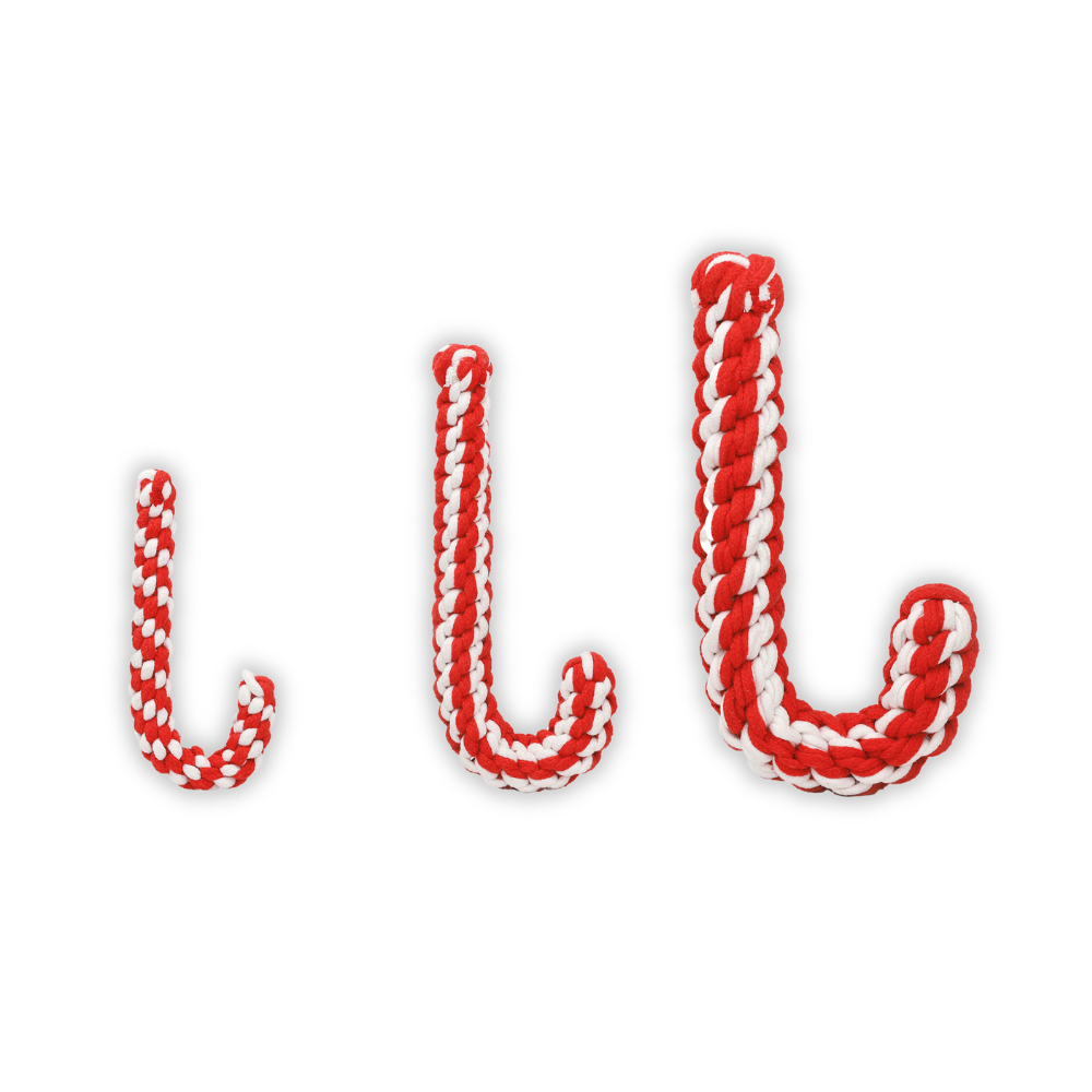 Red and white candy cane-shaped dog toys on a white background