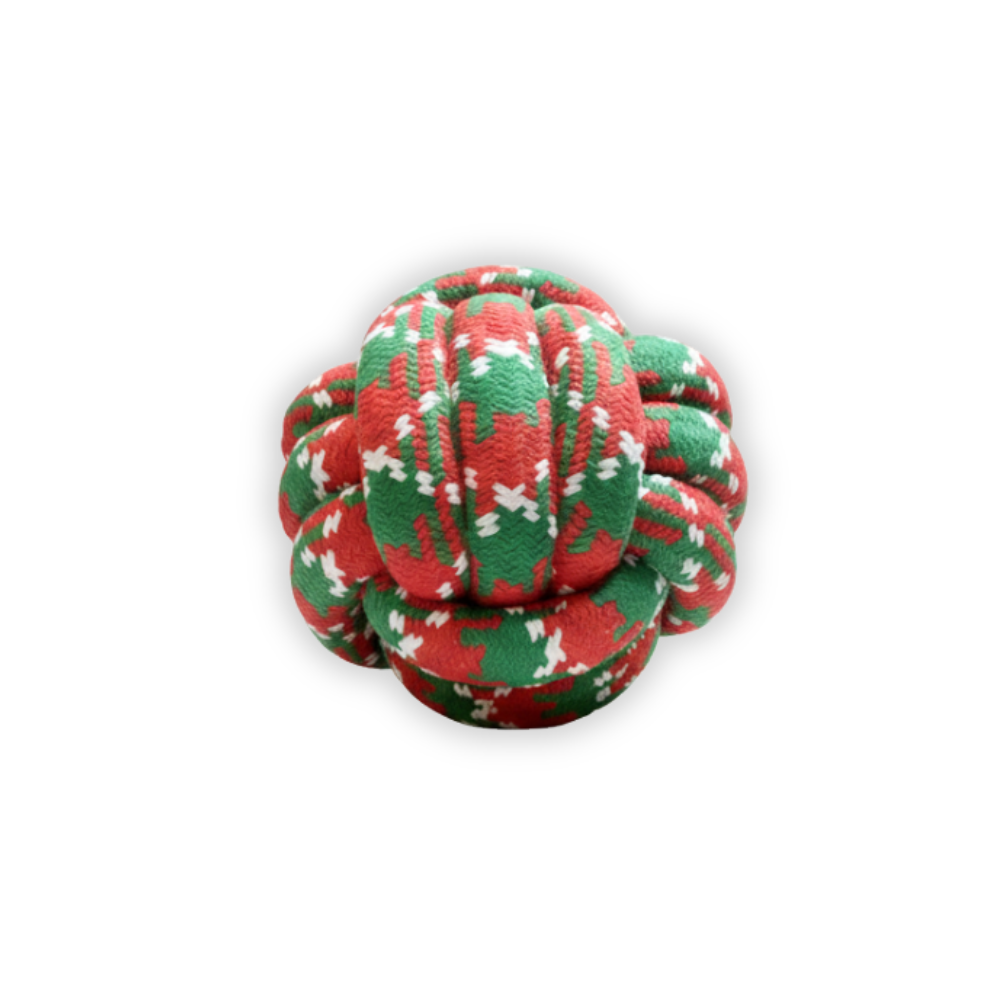 Red, green, and white knotted rope toy on a white background