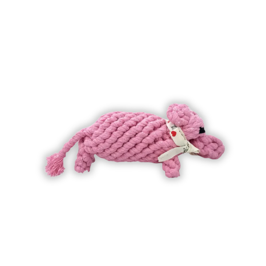 Pink knitted dog toy on a white background