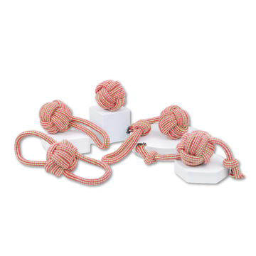Set of red and white rope toys with knot designs on a white background