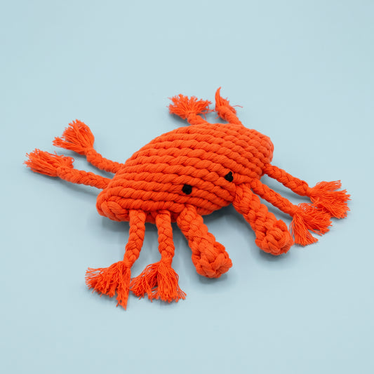 handmade crab rope toy for pet with light blue background