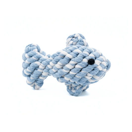 Yellow braided dog toy with tassels on a white background