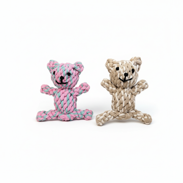 Two rope toys shaped like bears, one pink and blue, the other beige and brown, on a white background.