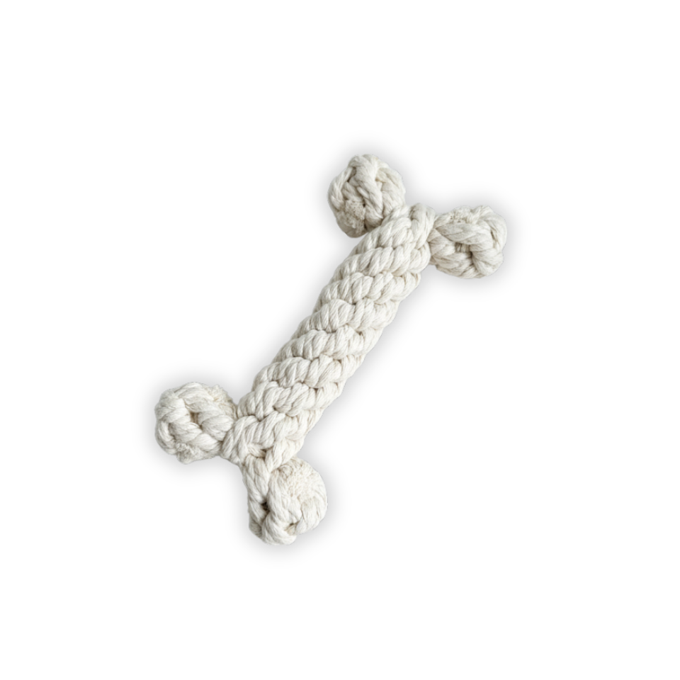 White knitted dog toy on a white background